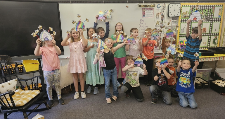 Storytime - Kids holding rainbows with bees 